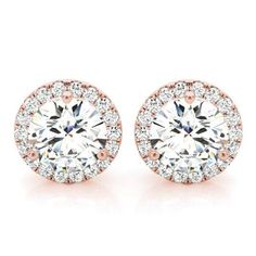 The sense of elegance is incomparable in this pair of classical halo diamond stud earrings. A staple item in any jewelry trove that is the perfect addition to any outfit or occasion. These exceptional halo diamond stud earrings feature a glittering display of fiery full cut, round brilliant cut diamonds. These diamonds have a total combined weight of 1.10 carats with the center stone carat weight measuring 0.70 Ct. Metal : 14K Gold Setting Type : U-Pave Total Carat : 1.10 Carats Type : Natural D Halo Diamond Earrings, Rose Gold Halo, Halo Earrings, Halo Earrings Studs, Gold Halo, Diamond Stud Earrings, Diamond Stud, White Rose Gold, Gorgeous Earrings