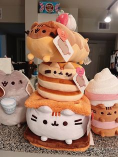 there are many stuffed animals stacked on top of each other