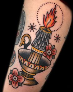 a tattoo with a vase and flowers on the arm, which is decorated with stars