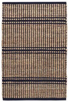 an area rug with black and tan stripes on the bottom, in front of a white background