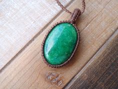 Treated Brazil Emerald macrame pendant, Green Chakra necklace. Emerald works with the Heart Chakra and blissful love. It is the strongest example of healing green ray energy. Use Emerald to bring love, loyalty, unity, and wisdom to your life. In small groups Emerald can encourage bonding, and strengthen communication and understanding, helping each person to adequately express themselves. Emerald enhances memory and mental clarity. Meditating with Emerald can help one to connect to Divine Love, Green Macrame Necklace As A Gift, Green Macrame Necklace As Gift, Green Macrame Necklace For Gift, Necklace Green Stone, Green Chakra, Stone Macrame, Emerald Pendant Necklace, Emerald Necklace Pendant, Macrame Pendant