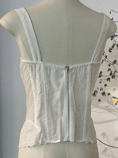 This is perfect for those who are looking for a clothing for a good price. It is fashionable, stylish, and it will look great on anyone who wears it. Do you wanahavit? White Summer Tops With Built-in Bra, White Tank Top With Built-in Bra For Day Out, White Cotton Chic Camisole, Chic White Cotton Camisole, White Lace Cotton Tank Top, Summer White Lace Camisole, White Lace Summer Camisole, White Cotton Camisole For Day Out, White Lace Trim Tank Top For Day Out