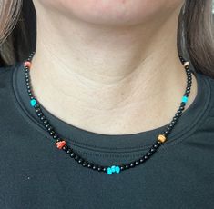 Subtle, Southwestern, and versatile beaded genuine Black Onyx, Turquoise, and Spiny Oyster necklace that is handcrafted by me! It adds a pop of color and a Southwestern vibe to your outfit. This simple and cute necklace would be a great addition to your outfit and could be paired with anyting! All findings are 925 sterling silver. Measurements: 18" long with 4mm round Black Onyx beads and 4mm Turquoise and Spiny Oyster nuggets. The necklace is a beaded necklace with a lobster claw clasp. Handcra Handmade Southwestern Black Beaded Necklace, Southwestern Black Beaded Necklaces For Gifts, Southwestern Style Black Beaded Necklaces As Gift, Southwestern Black Beaded Necklace Gift, Southwestern Style Black Beaded Necklaces For Gifts, Southwestern Style Black Beaded Necklace For Gift, Southwestern Black Necklace With Colorful Beads, Adjustable Black Beaded Turquoise Necklace, Handmade Adjustable Black Turquoise Necklace