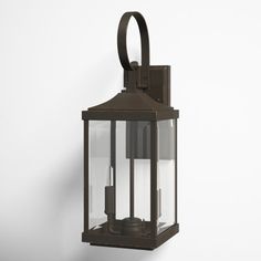 an old fashioned lantern hanging on the wall