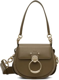 Buffed calfskin and suede shoulder bag in khaki. Logo hardware at face. · Detachable carry handle · Detachable and adjustable shoulder strap · Concealed patch pocket at face · Foldover flap · Card slot at interior · Cotton twill lining · H7 x W8 x D3 in Supplier color: Deep khaki | Chloé Khaki Small Tess Bag Chloe Tess Day Bag Outfit, Tess Chloe Bag, Chloe Small Tess Bag, Chloe Tess, Chloe Faye Bag, Chloe Clothing, Chloe Shoulder Bag, Chloe Brown, Online Shopping Clothes