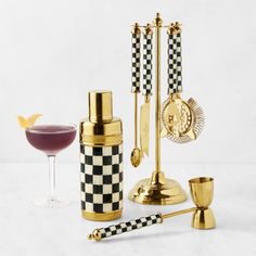 an assortment of cocktail garnishments, including a wine glass and two goblets