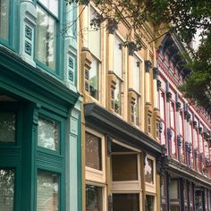 a row of multicolored buildings on a city street