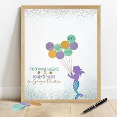 there is a mermaid holding some balloons