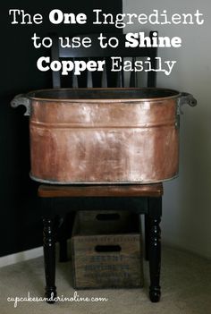 an old copper tub sitting on top of a wooden chair with the words, the one ingredient to use to shine copper easily