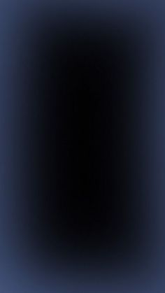 an abstract black and blue background with only one light at the top, no image to describe