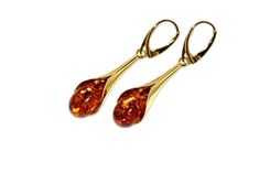 Exquisite  earrings handcrafted of sterling silver covered 14ct. gold and natural baltic amber.Vibrant cognac amber fitted in gold setting.This dainty jewellery will be beautiful accent for everyday style and for evening outfit il will nicely match. Amber stone created by nature over 25 millions years ego, amber attracts good luck, balances emotions, dissolves negative energy. Care Instructions: To maintain your jewellery, wipe gently with a cotton cloth that is soft and clean. Do not soak in wa Luxury Amber Earrings For Formal Occasions, Luxury Amber Earrings For Anniversary, Dainty Jewellery, Amber Earrings, Natural Amber, Amber Stone, Evening Outfits, Baltic Amber, Dainty Jewelry