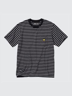 a black and white striped t - shirt with yellow logo on the chest