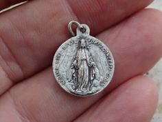 Religious antique French catholic silvered medal pendant Holy charm medallion of Saint Maria Goretti and Holy Virgin Mary. Measures are 0,64 x 0,77 inches ( 1,62 x 1,96 cm ) I bought this beautiful antique locket shrine on a brocante ( fleamarket ) in France. I deliver all over the world. If you want more photos or information, you can contact me. If you don't have paypal, you can pay by bank transfer. Registered shipping is possible. Please take a look at my other items for sale. Antique Silver Medallion With Miraculous Medal, Silver Miraculous Medal Pendant, Silver Pendant With Miraculous Medal, Saint Maria Goretti, St Maria Goretti, Maria Goretti, St Maria, Antique Locket, Our Lady Of Sorrows