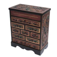 an ornate wooden chest with drawers