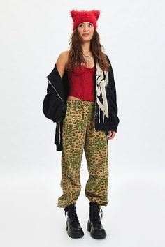 Sporty-cool BDG track pant in a slouchy, relaxed fit. Designed in an all-over cheetah camo print fabric featuring a mid-rise, elasticated waistband and contrast piping down the legs. Find them only at Urban Outfitters. Features BDG Jess cheetah camo track pants Wide leg track pant All-over cheetah camo print fabric Mid rise elasticated waistband Side pockets Piping down the legs Relaxed, wide-leg fit Full length Pull-on style UO exclusive Content + Care 100% Cotton Machine wash Imported Size + Fit Model in Camo is 5’8" and wearing size Small Measurements taken from size Small Inseam: 30.5" | BDG Jess Cheetah Camo Track Pant in Camo, Women's at Urban Outfitters Fall Camouflage Mid-rise Bottoms, Fall Camouflage Mid-rise Pants, Desert Camo Pants, Real Tree Camouflage Pants, Stretch Tiger Print Bottoms, Cheetah Pants, Bdg Jeans, Women Men Shoes, Camo Print