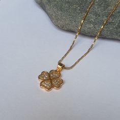 DESCRIPTION: This dainty minimalist clover necklace features a tiny 14k gold clover pendant adorned with sparkling CZ stones. Perfect for layering or everyday wear, it makes a thoughtful gift for friends and loved ones. BEST FEATURES: Crafted from 14k gold for a luxurious finish. Adorned with sparkling CZ stones for extra shine. Minimalist clover design, perfect for everyday wear. Lightweight and comfortable for long-term wear. Versatile piece, great for layering with other necklaces. ADVANTAGES Customer Gifts, Minimalist Flowers, Clover Necklace, Leaf Pendant, Perfect Gift For Her, Cz Stone, Everyday Jewelry, Flower Necklace, Thoughtful Gifts