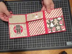 someone is cutting out some cards on a cutting board with scissors and tape to make it look like they are making gingerbreads