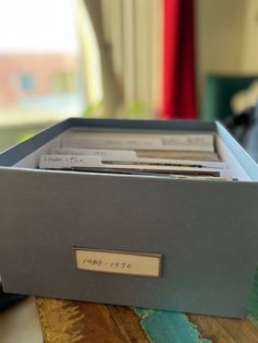 an open box containing files on a table