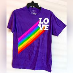 Love Tee * Pride Collection * Purple With Rainbow T-Shirt * Unisex Tee * Men’s Cut S * Short Sleeve 100% Cotton White Lettering With Big Rainbow Men’s Size Small Nwt - New And Unworn. Mailed From A Smoke-Free & Pet-Free Home Office. Bundle Items To Save On Shipping! Casual Pride Crew Neck T-shirt, Casual Crew Neck T-shirt For Pride, Pride Pre-shrunk Short Sleeve Tops, Short Sleeve Shirt With Graphic Print For Pride, Pre-shrunk Short Sleeve Tops For Pride, Casual Graphic Print T-shirt For Pride, Crew Neck Cotton Top For Pride, Casual Rainbow Tops, Casual Cotton T-shirt For Pride