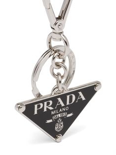 triangle-logo keyring from PRADA featuring silver-tone, black, metal, logo lettering, triangle shape and signature Air Jordan Wings logo keyring. Luxury Logo Charm, Chains Men, Jordan Wings, Trendy Shoes Sneakers, Wings Logo, White Accessories, Metal Keychain, Triangle Logo, Metal Logo