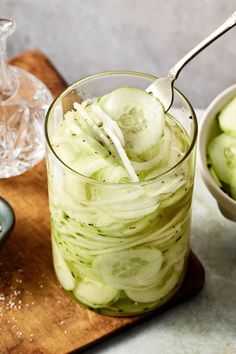 cucumber slices in a jar with a spoon