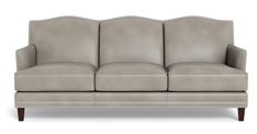 a gray couch with wooden legs and nail polishing on the armrests, in front of a white background