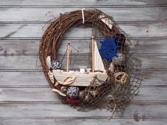 a wreath with a sailboat on it