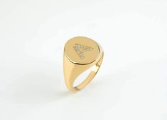 This trendy initial diamond ring is made of solid gold. You can set with diamonds your favourite letter as all letters are available ( or numbers) and create your personalized signet ring. The possibilities to engrave it are endless, your initials, your beloved s initials, your kids, etc. ✔ Made to Order ✔ Gold Kt: 9k-14K-18k ✔ Available Gold Color: Rose Gold, Yellow Gold, White Gold ✔ Gemstone: Genuine Diamonds, or other genuine gemstones ✔ Stone Cut: Round ✔ Number of Stones: 12 (depended on t Yellow Gold Diamond Initial Ring Hallmarked, Luxury Personalized Diamond Initial Ring, Yellow Gold Diamond Rings With Initials, Formal Diamond Ring With Initials, Elegant Yellow Gold Diamond Ring With Initials, Initials Engraved Diamond Ring, Gold Diamond Signet Ring With Initials, Formal Fine Jewelry Diamond Ring With Initials, Yellow Gold Diamond Ring With Initials For Anniversary