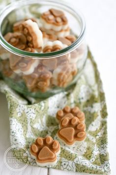 some dog paw treats are in a glass bowl