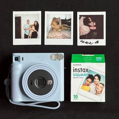 an instax camera, polaroid film and other items are on the table