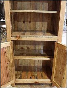 an old wooden bookcase with three shelves