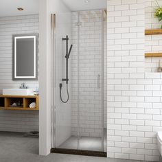 a bathroom with a sink, mirror and shower stall in the middle of the room