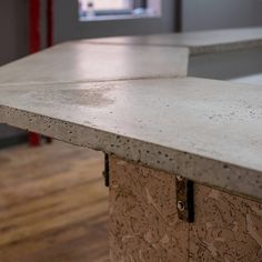 the counter top is made out of concrete