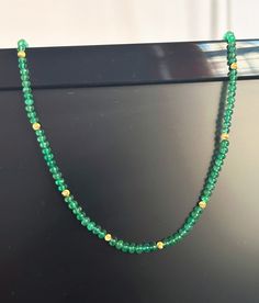 Deep Green Emerald 18K Gold Choker Necklace, 3-4 mm Emerald Rondelles & Gold beads, Emerald beaded necklace gold findings, Custom Necklace Gemstones : 100% Natural Emerald Unheated and Untreated Metal : 18K Gold (Gold beads)               14K Gold (Gold Clasp) Natural :Natural Zambian Emeralds Clarity : Clean GENUINE : 100% (Emerald and Gold) Color : Deep Green Emerald beads Transparency : Transparent gemstones  Country/Region of Manufacture :India Weight details : Total Weight : 10 Grams approx Gold Rondelle Necklace With Gemstone Beads, Gold Necklaces With Rondelle Gemstone Beads, Emrald Beeds Necklace Gold, Gold Single Strand Emerald Necklace As Gift, Yellow Gold Rondelle Beaded Necklace As Gift, Yellow Gold Rondelle Beaded Necklace For Gift, Yellow Gold Rondelle Beaded Necklaces For Gifts, Gold Rondelle Beaded Necklace With Gemstone Beads, Gold Rondelle Beaded Necklaces With Gemstone Beads