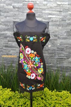 This lovely yellow was handmade in Mexico. The beautiful colorful flowers were embroidered by hand, so each one is unique. You will love wearing this comfortable cotton dress with short sleeves. It is perfect for a hot summer day. This dress comes just above or below the knee, depending on how tall Handmade Multicolor Dresses For Spring, Handmade Multicolor Spring Dresses, Handmade Bohemian Dresses With Multicolor Embroidery, Traditional Multicolor Embroidered Sleeveless Dress, Traditional Multicolor Sleeveless Embroidered Dress, Folk Multicolor Embroidered Dress For Fiesta, Summer Embroidered Multicolor Dress, Summer Embroidered Dress With Multicolor Embroidery, Bohemian Summer Embroidered Dress