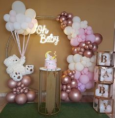 a baby's first birthday party with balloons, cake and teddy bears on display