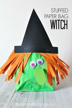 a paper bag with a witch's hat on it and the words, stuffed paper bag witch