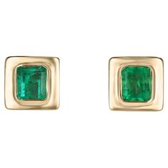 Elevate your style with our exquisite bezel-set emerald earrings, each showcasing mesmerizing Colombian emeralds with a medium vivid green hue and semi-transparent clarity. Crafted in luxurious 18k yellow gold and featuring an elegant latch-back closure, these earrings exude sophistication and timeless beauty, perfect for adding a touch of glamour to any ensemble. Setting Style: Bezel Setting Material: 18K Yellow Gold Main Stone: Emerald Count: 2 Shape: Emerald Cut Approx Weight: 1.85-Carats Clarity: Semi-Transparent Color: Green Luster: Good Treatments: Natural, Oiling Origin: Colombia Estimated Retail Value: $11,290.00 USD A certificate of appraisal is provided upon purchase. Emerald Cut Stud Earrings, Emerald Anniversary, Earring Video, Emerald Stud Earrings, Emerald Green Earrings, Rose Gold Earrings Studs, White Gold Earrings Studs, White Gold Studs, Emerald Earrings Studs