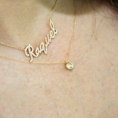 Say your name in diamonds! Customize a necklace with your own name or a loved ones name. Precious Metal: 14K Solid Yellow Gold Stones: Diamonds. Total weights vary depending on letters and length. Adjustable: 16” - 18” Lock: Spring Lock Font: Script Size of letters: 11mm All personalized items are Final Sale. Ship between 6 to 8 weeks (excluding holidays). Other pieces shown on the pictures are sold separately Comes in our beautiful gift box Important: Please use the "note box" at checkout (befo Diamond Nameplate Necklace With Diamond Accents, Diamond Accent Nameplate Necklace, Fine Jewelry Diamond Name Necklace With Accents, Fine Jewelry Diamond Accented Name Necklace, Fine Jewelry Diamond Accents Name Necklace, Diamond Nameplate Necklaces, Custom Name Diamond Necklace, Personalized Diamond Nameplate Necklace, Diamond Name Necklace