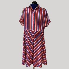 This 1970'S colorful shirtdress was made by Sears in the U.S. It is unlined polyester with a collar, cuff sleeves, bias-cut skirt, side pockets, and faux pearl buttons.  bust: 34" waist: 34" waist-to-hem: 24" Retro Collared Multicolor Dresses, Retro Summer Shirt Dress For Daywear, Retro Collared Shirt Dress For Summer, Vintage Collared Shirt Dress For Summer, Bias Cut Skirt, Pearl Buttons, Shirtdress, Made In America, Dress Clothes For Women