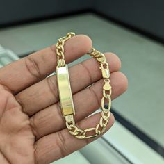 10kt Real Gold Figaro Id Bracelet Size 7.8 Inch Length Weight 7.26 Gm Link 7.1 Mm Wide Id Plate 1.55 Inch Long Id Plate 9.1 Mm Wide Please Check The Picture Carefully To Understand The Size Of The Thickness 100% Authentic Gold Not A Gold Filled Or Not A Gold Plated Never Change Color Or Never Fade Never Tarnish Comes In A Gift Box 14k Gold Figaro Chain Nameplate Jewelry, 14k Yellow Gold Name Bracelet With Polished Finish, Yellow Gold Nameplate Bracelet For Anniversary, 14k Gold Nameplate Bracelet For Formal Occasions, 14k Gold Nameplate Bracelets With Polished Finish, 14k Gold Nameplate Bracelet With Polished Finish, 14k Gold Formal Nameplate Bracelet, Tarnish Resistant Gold Nameplate Bracelet For Formal Occasions, Tarnish Resistant Gold Nameplate Bracelet For Formal Events