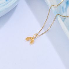 Add a playful touch to your style with our Rainbow Necklace. This charming piece combines the timeless elegance of gold with the joyous of a rainbow. The dainty rainbow necklace symbolizes positivity, diversity, and love. Embrace the cheerful and inclusive spirit of our Rainbow Necklace, and let your style shine with positivity and love - Made in 14k solid gold - Pendant: 7x9 mm / 0.27x0.35 inches - Pendant Thickness: 1.75 mm / 0.07 inches - This product comes with iconic Norm Jewels gift box Elegant Rainbow Pendant Necklaces, Rainbow Necklace With Adjustable Chain For Gift, Dainty Rainbow Jewelry For Everyday Wear, Minimalist Rainbow Jewelry For Gift, Minimalist Rainbow Jewelry As Gift, Baguette Earring, Dot Ring, Stacker Rings, Baguette Ring