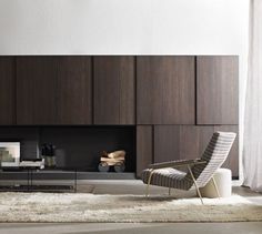 a living room filled with furniture and a fire place next to a wall mounted tv