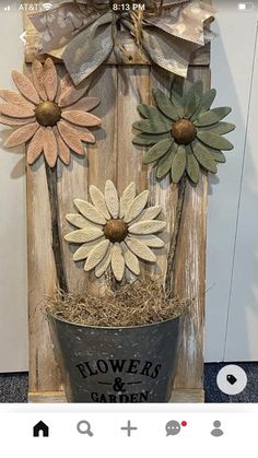 a flower pot with some flowers in it