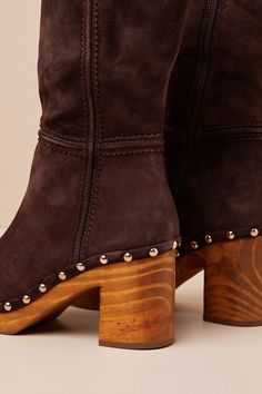 The Matisse Village Chocolate Suede Leather Platform Mid-Calf Boots are ready to be paired with falling leaves and a PSL! These too-cute boots have a genuine suede leather construction that shapes a rounded-toe upper atop a 1"" toe platform that boasts gold studded accents. The 10"" mid-calf shaft features seam detailing and a 13.25"" circumference. A 10.5"" zipper and gusset detail at the instep allow for easier styling, while a wood block heel completes the Boho-style look! Available in whole Cute Boots, Falling Leaves, Calf Boots, Heel Boots, Mid Calf Boots, Wood Blocks, High Heel Boots, Gold Studs, Mid Calf