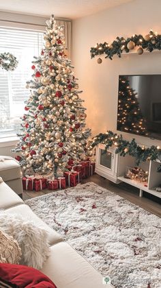 a living room with a christmas tree in the corner