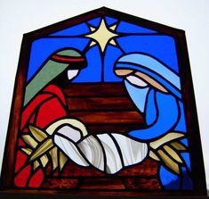 a stained glass window depicting the birth of jesus