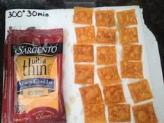 some kind of crackers sitting on top of a table next to a bag of chips