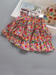 Time for some flower fun in the summer sun! With a tiered floral skirt in her wardrobe, her adventures will be extra cute and charming. Just the right amount of sunshiney vibes to brighten up her season. Soft, lightweight fabric flows with her movements. Easy-breezy, beautiful finish! Elastic waist allows wiggle room, so she won't feel restricted during adventures. Perfect for cowgirl fashion, summer adventures, casual outings, photoshoots, and more Tiered floral skirt with elastic waist Available in sizes 2T-7Y for toddlers and little girls Spring Playful Ruffled Bottoms, Playful Ruffled Bottoms For Spring, Spring Ruffled Bottoms For Playtime, Ruffled Bottoms For Summer Playtime, Spring Playtime Ruffled Bottoms, Cute Summer Bottoms For Playdate, Multicolor Bottoms For Summer Playtime, Multicolor Summer Bottoms For Playtime, Multicolor Fun Bottoms For Spring