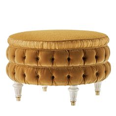 the foot stool is made out of gold velvet